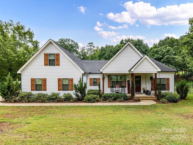 618 Deese Rd, Monroe, NC 28110 - modern farmhouse style home with a front yard, covered porch, and roof with shingles