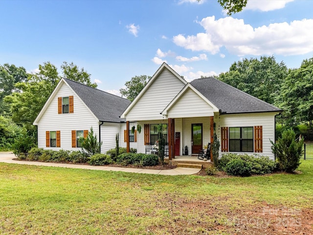 618 Deese Rd, Monroe, NC 28110 - view of front of home featuring covered porch, roof with shingles, and a front lawn