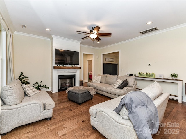 618 Deese Rd, Monroe, NC 28110 - living room with crown molding, a ceiling fan, wood finished floors, a fireplace, and recessed lighting
