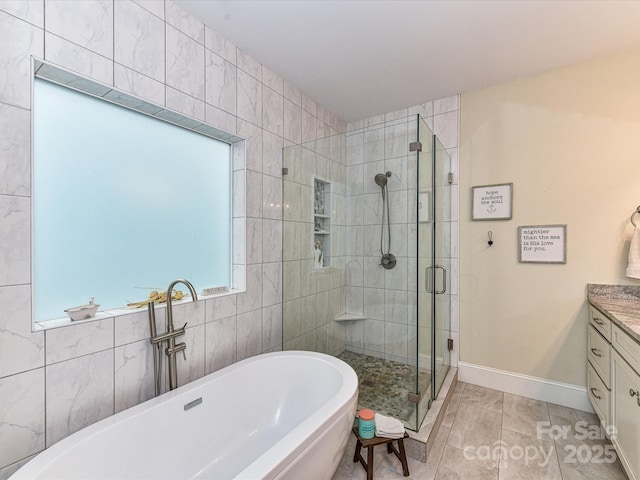 618 Deese Rd, Monroe, NC 28110 - full bathroom with a shower stall, a freestanding tub, and vanity