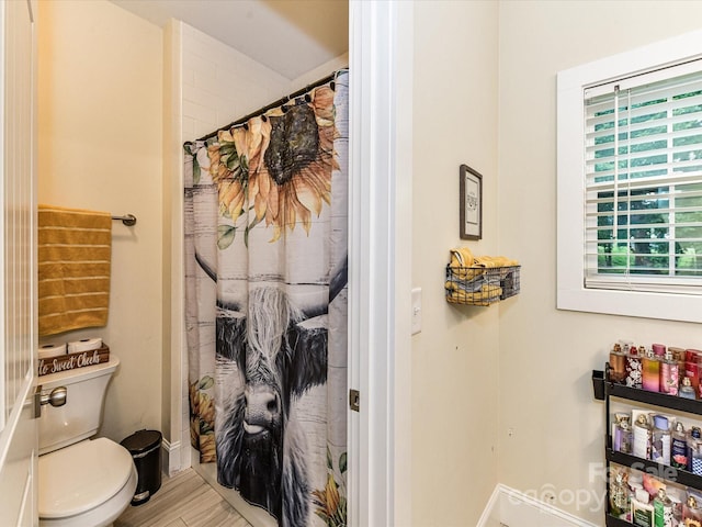 618 Deese Rd, Monroe, NC 28110 - bathroom with wood finished floors and a shower with shower curtain