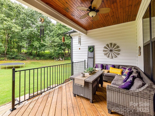 618 Deese Rd, Monroe, NC 28110 - deck with a trampoline, an outdoor hangout area, ceiling fan, a yard, and view of wooded area
