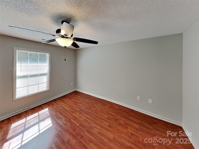 1108 Brookwood Dr, Stanley, NC 28164 - empty room featuring wood finished floors, a ceiling fan, and a textured ceiling