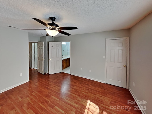 1108 Brookwood Dr, Stanley, NC 28164 - spare room with ceiling fan, wood finished floors, and a textured ceiling