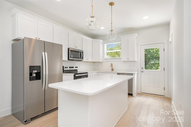 782 Stanley Spencer Mtn Rd, Gastonia, NC 28056 - kitchen with appliances with stainless steel finishes, light wood-type flooring, white cabinetry, light countertops, and recessed lighting