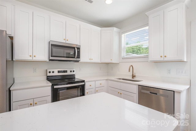 782 Stanley Spencer Mtn Rd, Gastonia, NC 28056 - kitchen with stainless steel appliances, white cabinets, and recessed lighting