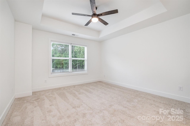 782 Stanley Spencer Mtn Rd, Gastonia, NC 28056 - carpeted empty room with a tray ceiling and a ceiling fan
