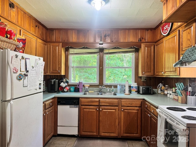 140 Wallins Way, Mars Hill, NC 28754 - kitchen featuring white appliances, light countertops, and brown cabinetry