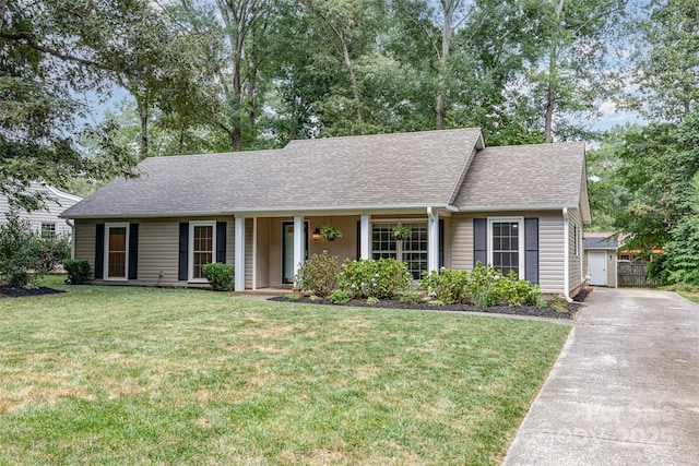 7017 Brookgreen Ter, Matthews, NC 28104 - view of front of home featuring roof with shingles, a front yard, and concrete driveway