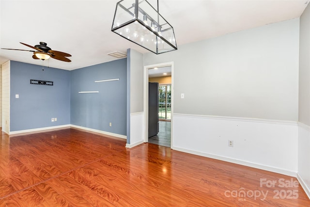 7017 Brookgreen Ter, Matthews, NC 28104 - spare room with ceiling fan and wood finished floors