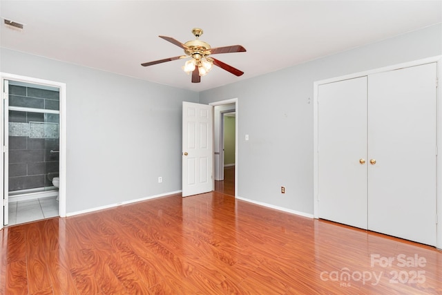 7017 Brookgreen Ter, Matthews, NC 28104 - unfurnished bedroom with light wood-style flooring, ensuite bath, a closet, and ceiling fan