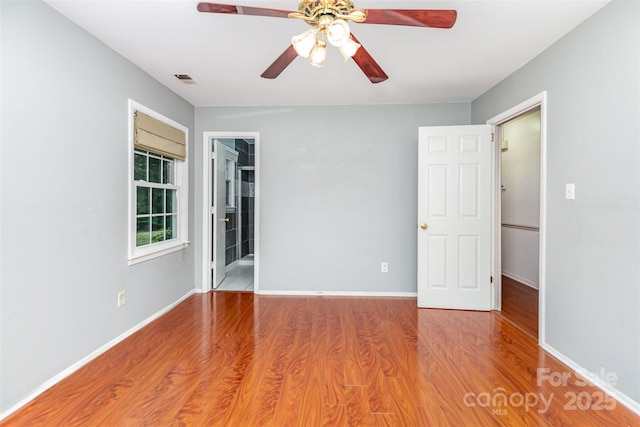 7017 Brookgreen Ter, Matthews, NC 28104 - unfurnished room featuring a ceiling fan and wood finished floors