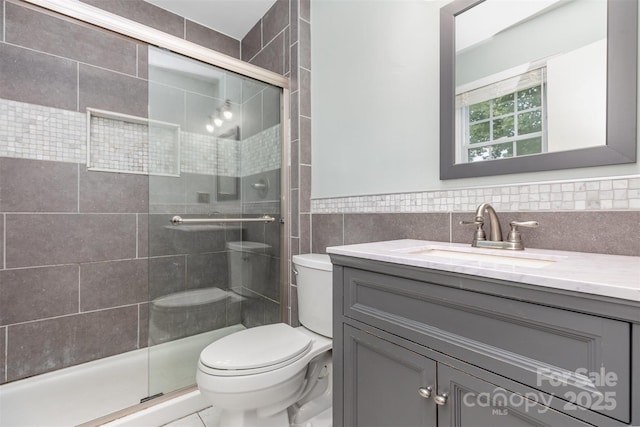 7017 Brookgreen Ter, Matthews, NC 28104 - full bathroom featuring vanity, tile walls, and a shower stall