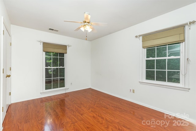 7017 Brookgreen Ter, Matthews, NC 28104 - spare room featuring wood finished floors and ceiling fan