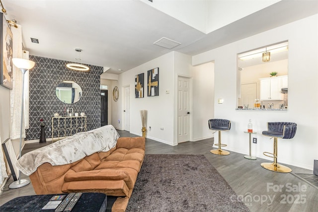 8424 Spirea Ct, Charlotte, NC 28215 - living area with wood finished floors and an accent wall