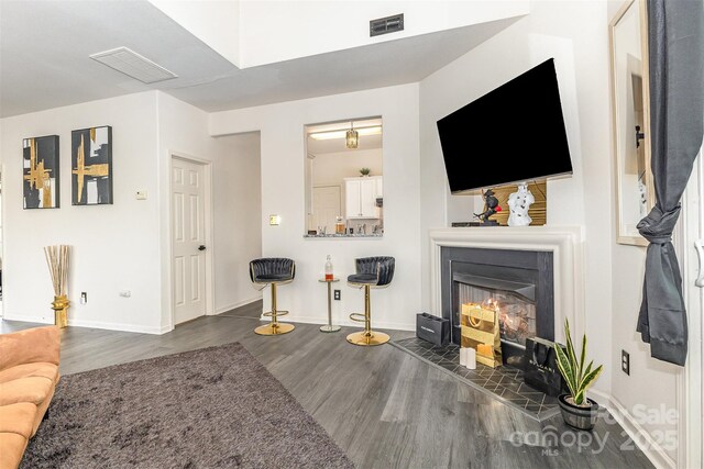8424 Spirea Ct, Charlotte, NC 28215 - living area featuring wood finished floors and a glass covered fireplace