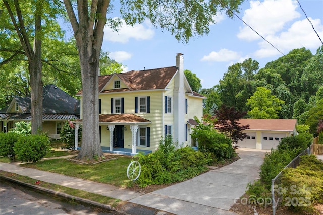 522 Alexander St, Statesville, NC 28677 - view of front facade with a porch, a chimney, driveway, and a front yard
