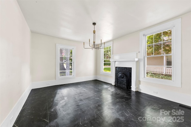522 Alexander St, Statesville, NC 28677 - unfurnished living room featuring a chandelier and a fireplace