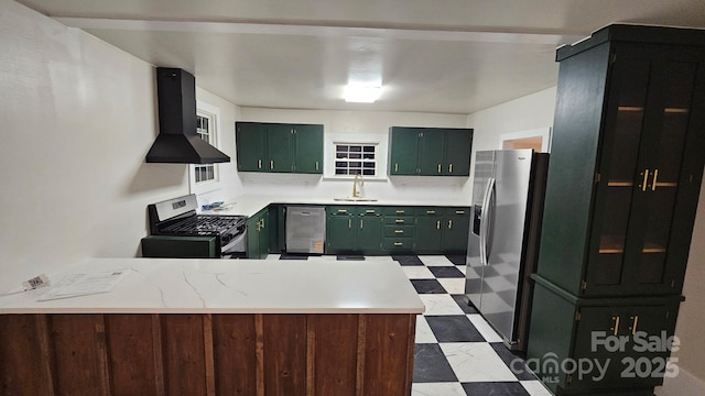 522 Alexander St, Statesville, NC 28677 - kitchen with stainless steel appliances, dark flooring, green cabinets, wall chimney exhaust hood, and a peninsula