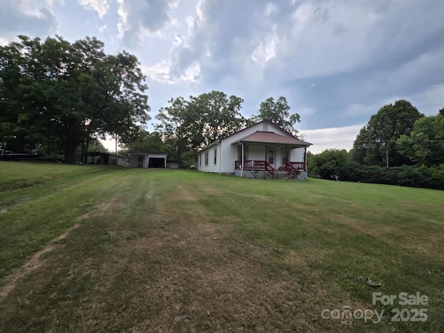 7601 Rhodhiss Rd, Connelly Springs, NC 28612 - view of green lawn with a porch