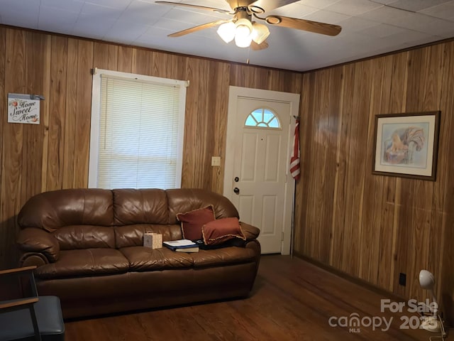 7601 Rhodhiss Rd, Connelly Springs, NC 28612 - living room featuring wooden walls, ceiling fan, and wood finished floors