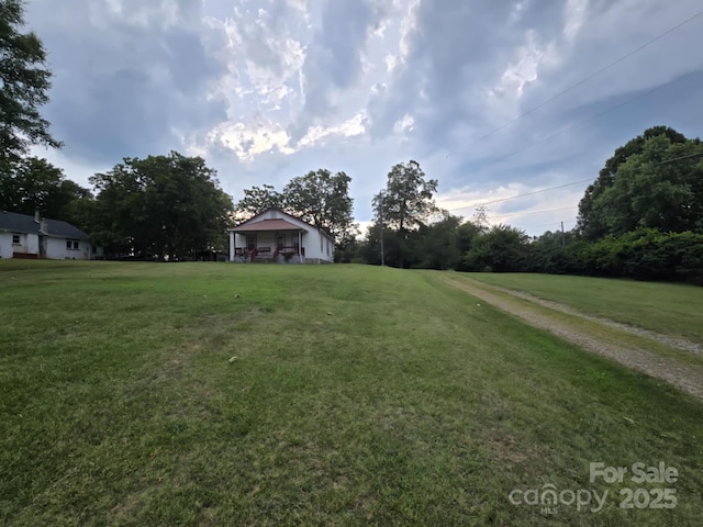 7601 Rhodhiss Rd, Connelly Springs, NC 28612 - view of grassy yard with view of scattered trees