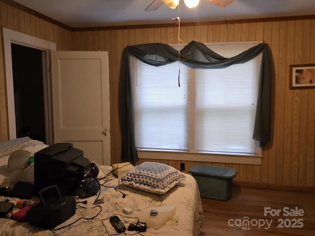 7601 Rhodhiss Rd, Connelly Springs, NC 28612 - bedroom with crown molding, wood finished floors, wooden walls, and ceiling fan