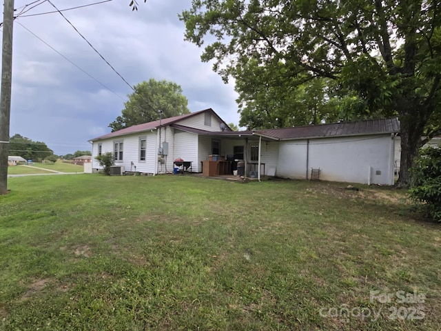 7601 Rhodhiss Rd, Connelly Springs, NC 28612 - back of house featuring a lawn