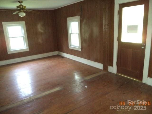 1374 Circle Dr, China Grove, NC 28023 - foyer with wood finished floors, a ceiling fan, and wooden walls