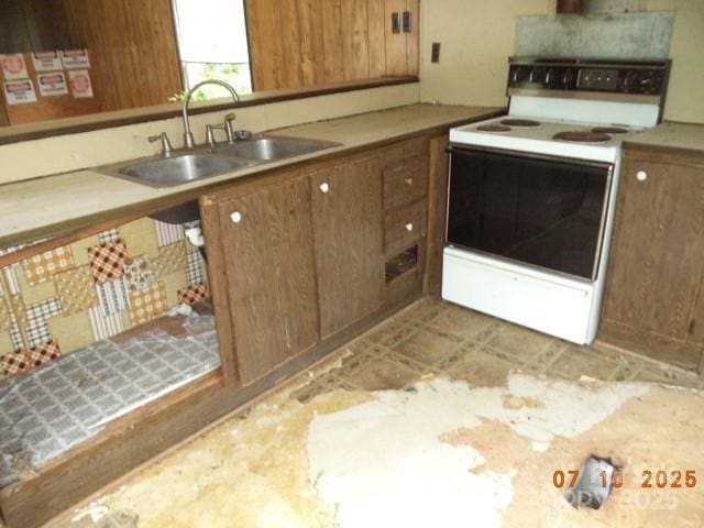 1374 Circle Dr, China Grove, NC 28023 - kitchen with white electric range oven, light countertops, and brown cabinets