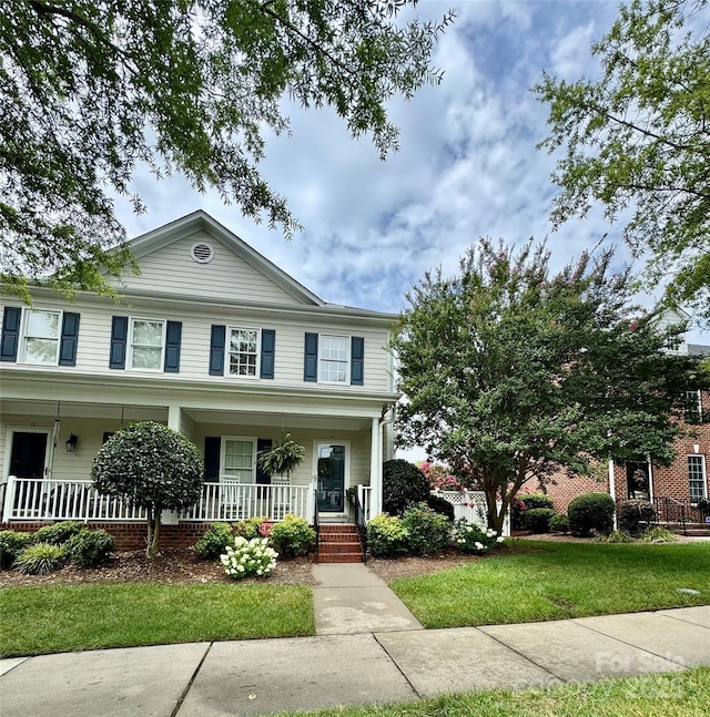 75 Mccurdy St NW, Concord, NC 28027 - view of front of home with a porch and a front yard
