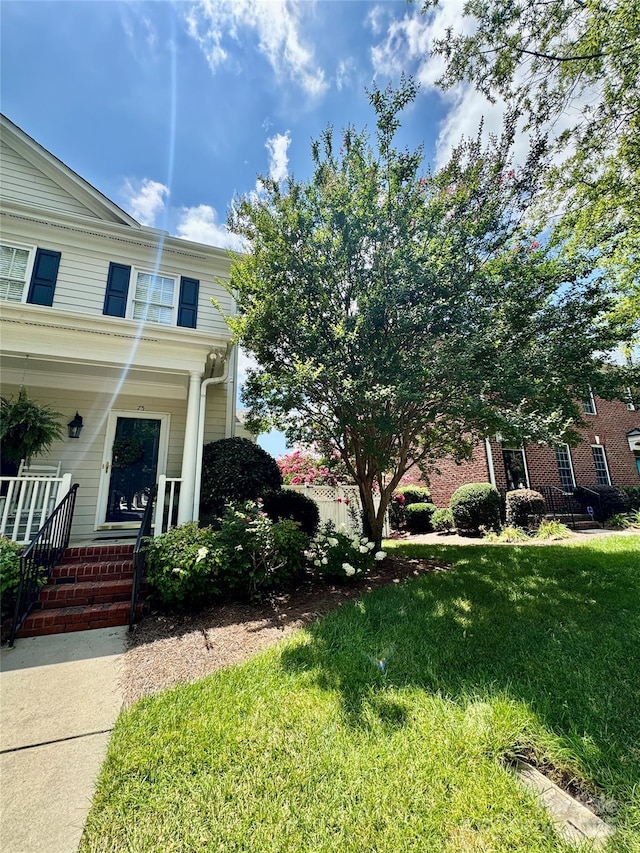 75 Mccurdy St NW, Concord, NC 28027 - view of front of home with a front lawn and a porch