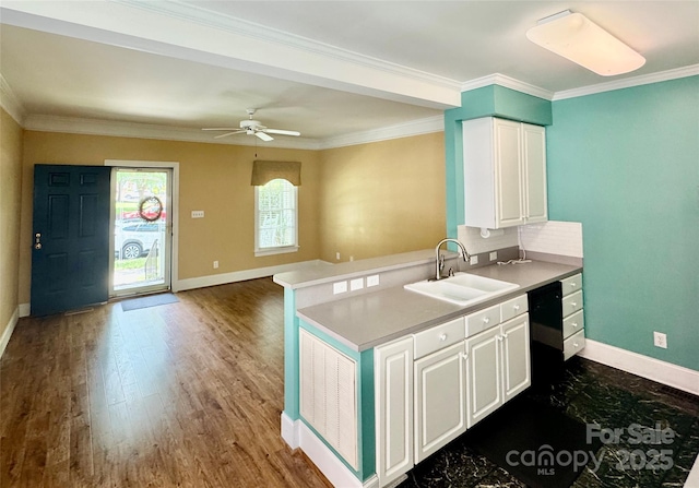 75 Mccurdy St NW, Concord, NC 28027 - kitchen with white cabinetry, wood finished floors, crown molding, ceiling fan, and light countertops