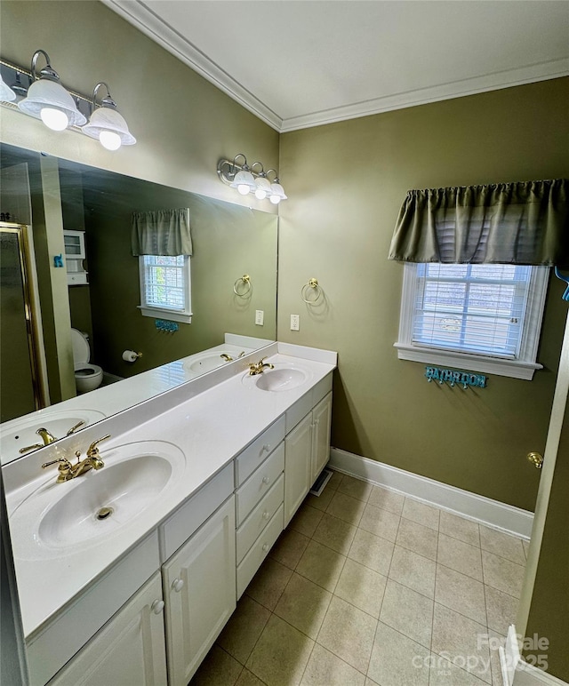 75 Mccurdy St NW, Concord, NC 28027 - bathroom with double vanity, plenty of natural light, tile patterned floors, crown molding, and a shower stall