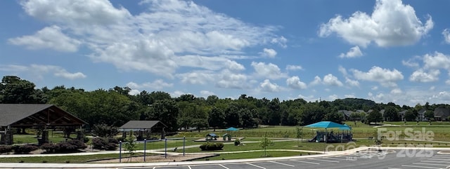 75 Mccurdy St NW, Concord, NC 28027 - surrounding community with a gazebo, a yard, and uncovered parking