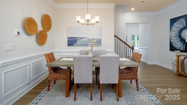4129 Duplin Dr, Charlotte, NC 28214 - dining area featuring a chandelier, ornamental molding, wood finished floors, recessed lighting, and wainscoting