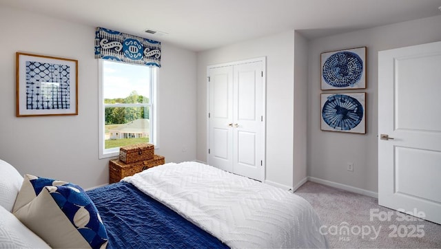 4129 Duplin Dr, Charlotte, NC 28214 - bedroom with light carpet and a closet