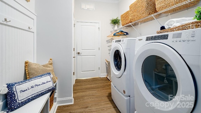 4129 Duplin Dr, Charlotte, NC 28214 - washroom with independent washer and dryer and wood finished floors