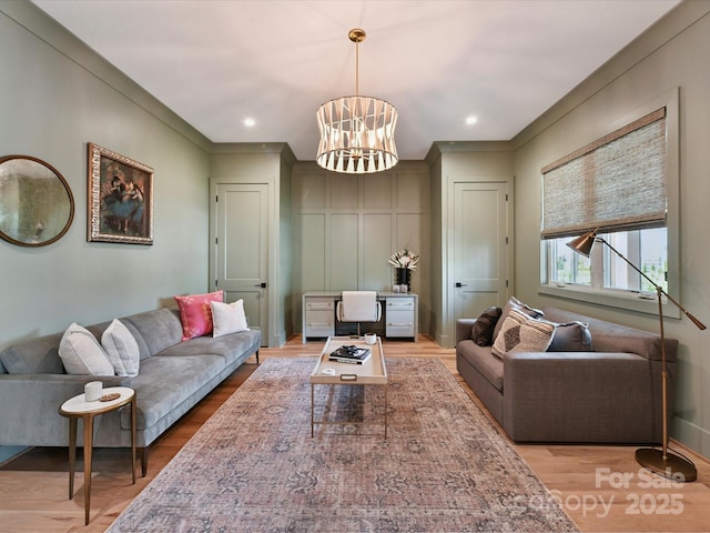 615 Melbourne Ct, Charlotte, NC 28209 - living area with light wood-style flooring and a chandelier