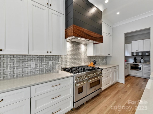 615 Melbourne Ct, Charlotte, NC 28209 - kitchen featuring double oven range, custom range hood, tasteful backsplash, light countertops, and recessed lighting