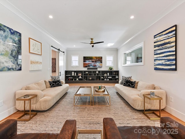 615 Melbourne Ct, Charlotte, NC 28209 - living area featuring a ceiling fan, a barn door, wood finished floors, crown molding, and recessed lighting