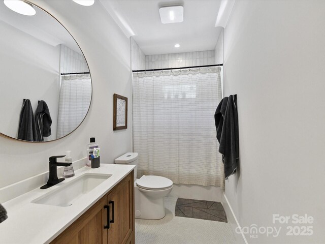 615 Melbourne Ct, Charlotte, NC 28209 - bathroom with vanity, shower / bath combo with shower curtain, tile patterned flooring, and recessed lighting