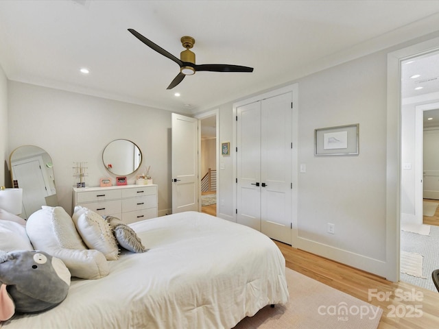 615 Melbourne Ct, Charlotte, NC 28209 - bedroom with light wood-style flooring, recessed lighting, a closet, and a ceiling fan