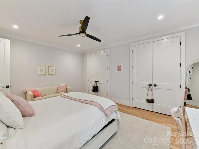615 Melbourne Ct, Charlotte, NC 28209 - bedroom with light wood-style floors, recessed lighting, multiple closets, and a ceiling fan