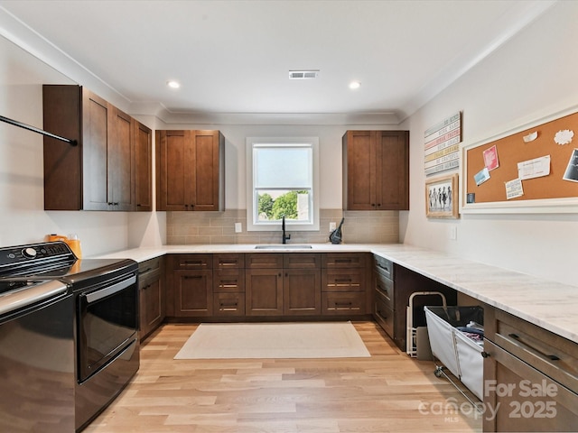 615 Melbourne Ct, Charlotte, NC 28209 - kitchen with separate washer and dryer, light wood finished floors, range with electric cooktop, tasteful backsplash, and recessed lighting
