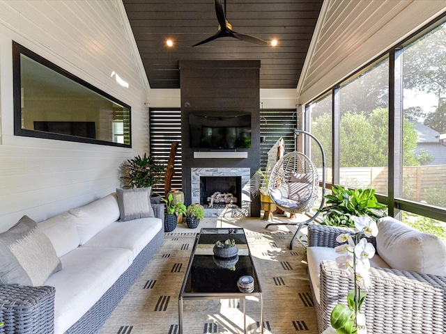 615 Melbourne Ct, Charlotte, NC 28209 - sunroom with an outdoor living space with a fireplace, plenty of natural light, and ceiling fan