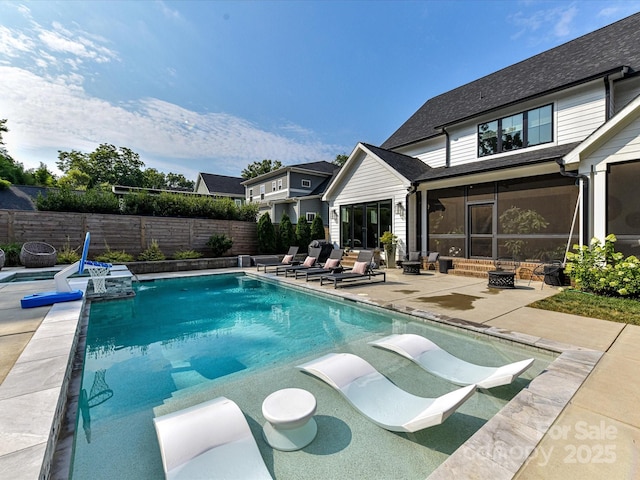615 Melbourne Ct, Charlotte, NC 28209 - view of swimming pool with a patio, a fenced backyard, and a sunroom