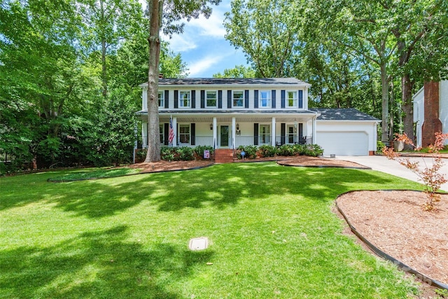 1220 Merribrook Dr, Matthews, NC 28105 - colonial inspired home featuring covered porch, a garage, concrete driveway, and a front lawn