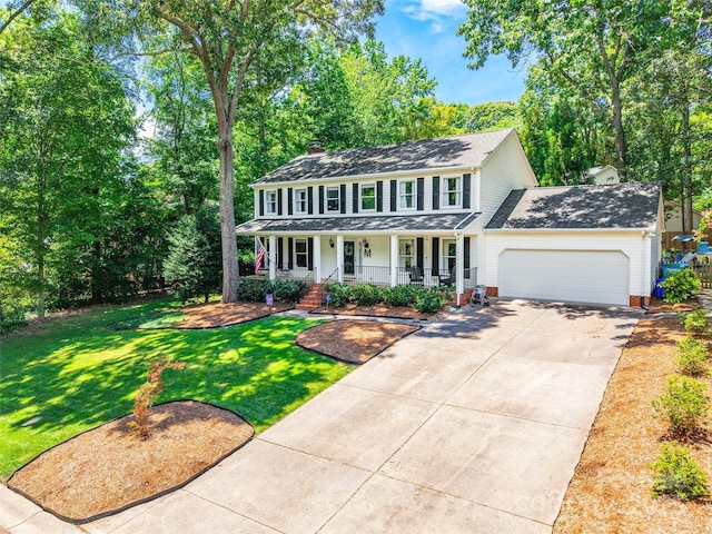 1220 Merribrook Dr, Matthews, NC 28105 - colonial-style house with covered porch, a chimney, driveway, a garage, and a front lawn