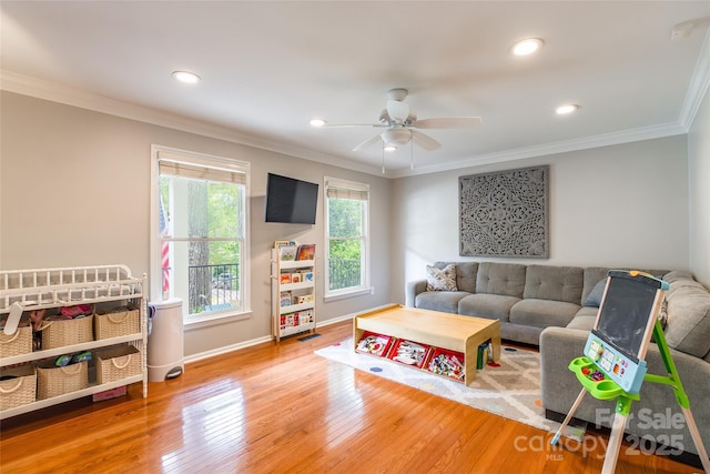 1220 Merribrook Dr, Matthews, NC 28105 - living room featuring hardwood / wood-style floors, recessed lighting, ornamental molding, and ceiling fan